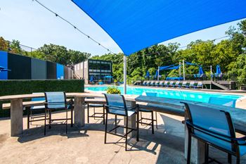 Covered poolside lounge & dining areas